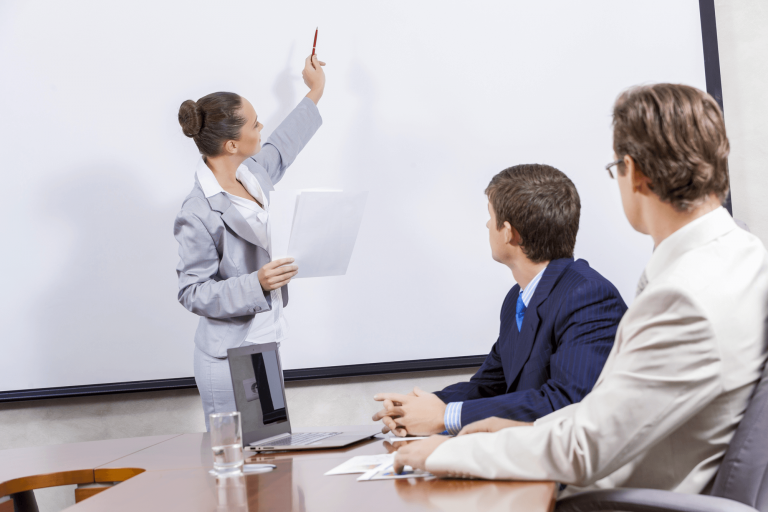 Photo of one of an organizational consultants giving a presentation at a client's office